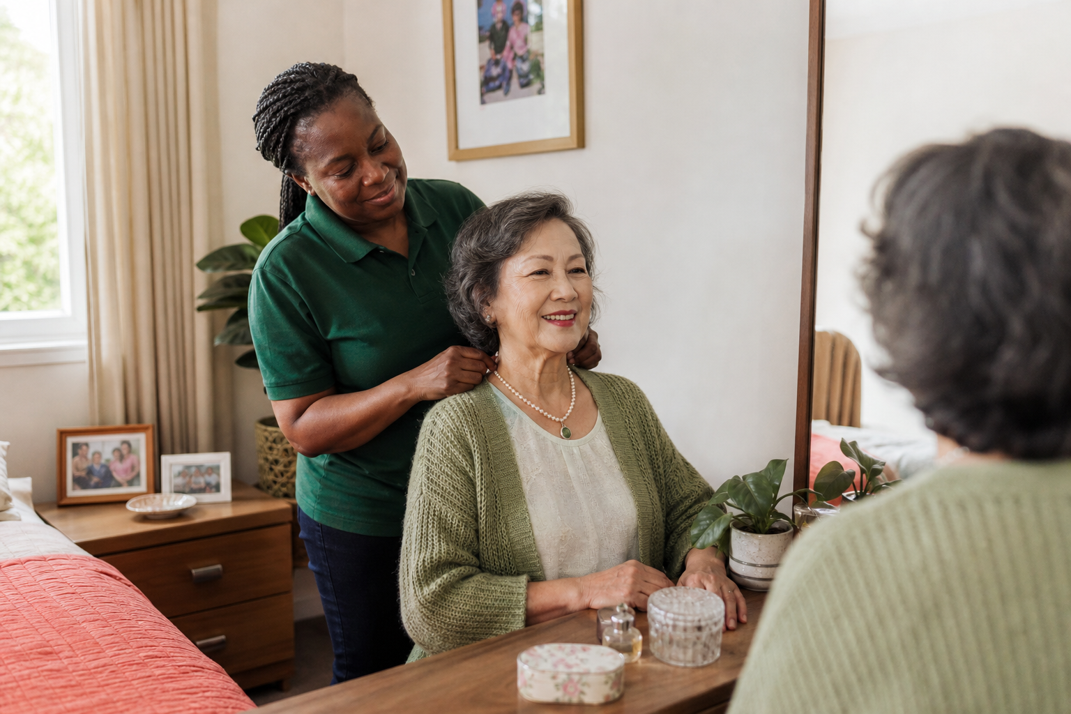A multicultural Australian support worker helping an older woman with her necklace at home